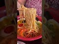 Indian girl trying Unique Laksa Ramen in London