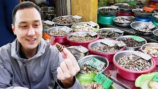 We ate some snails, crab claws, raw oysters, and fertilized quail eggs
in hai phong. the restaurant is located a small alley hidden
neighborhood of h...