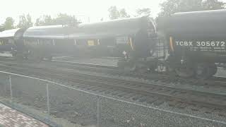 NS southbound tank train on a rainy afternoon