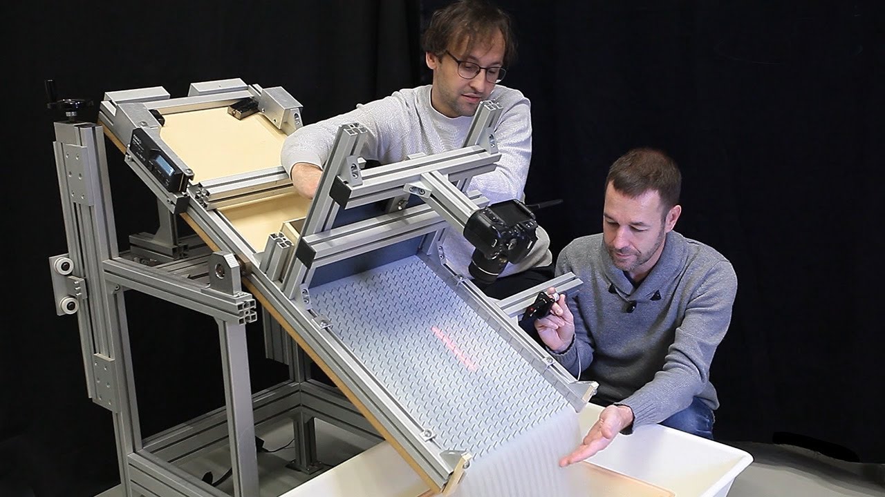 Downslope granular flow through a forest of obstacles