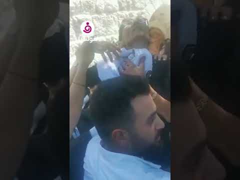 والدة جورج الراسي تبكيه بحرقة في مراسم تشييع جنازته