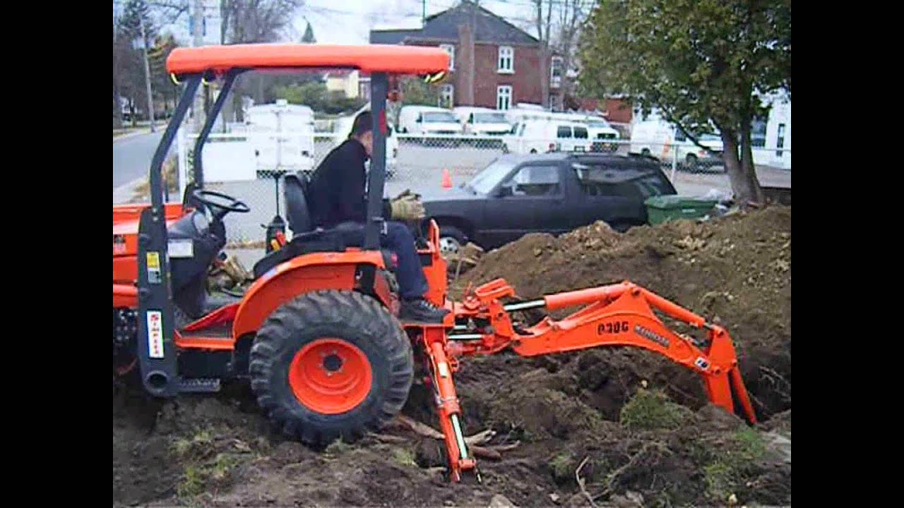 digging up the lawn with the backhoe YouTube