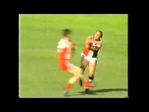 Tony Lockett caves in Peter Caven's lid