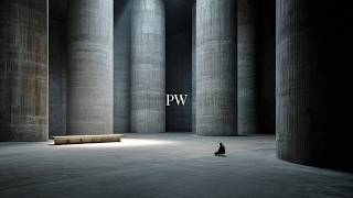 in a vast brutalist space for deep focus