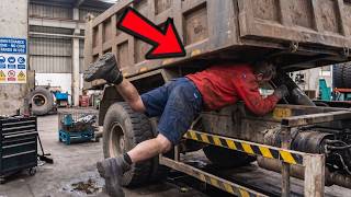 Worker Reached Under The Raised Dump Bed.