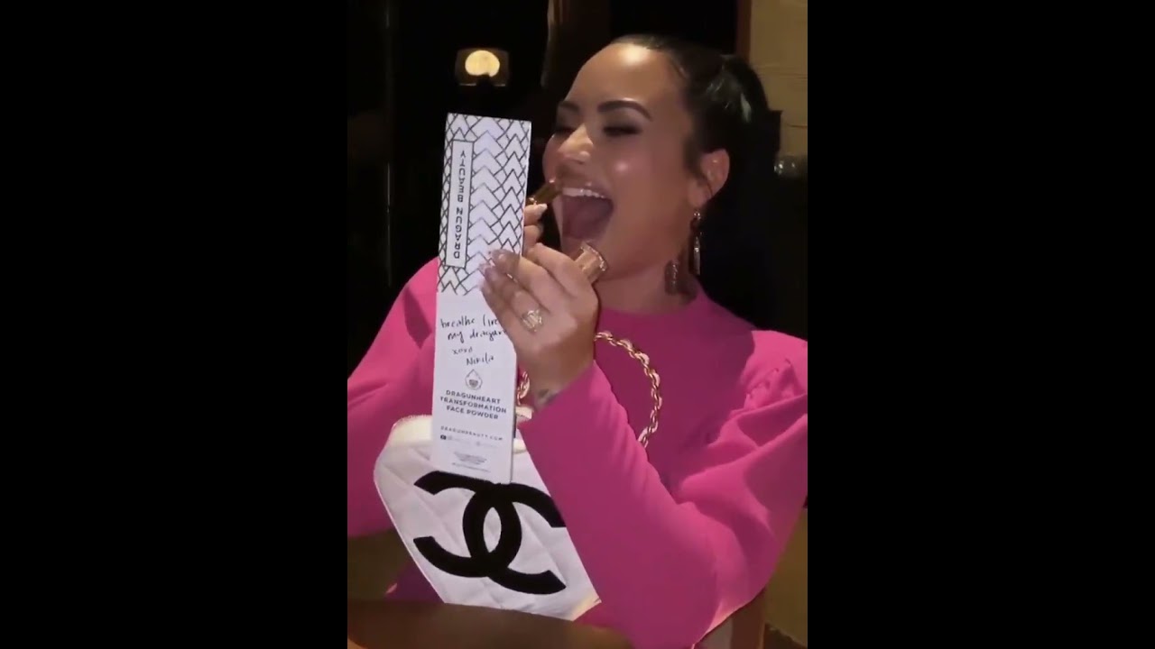 demi Lovato laughing while putting on lipstick stan twitter reaction meme