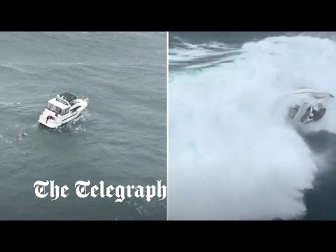 Moment boat is hit by giant wave during coast guard rescue