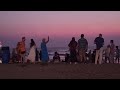 Hari Krsnas and Shiva Moon in Arambol at Sunset .