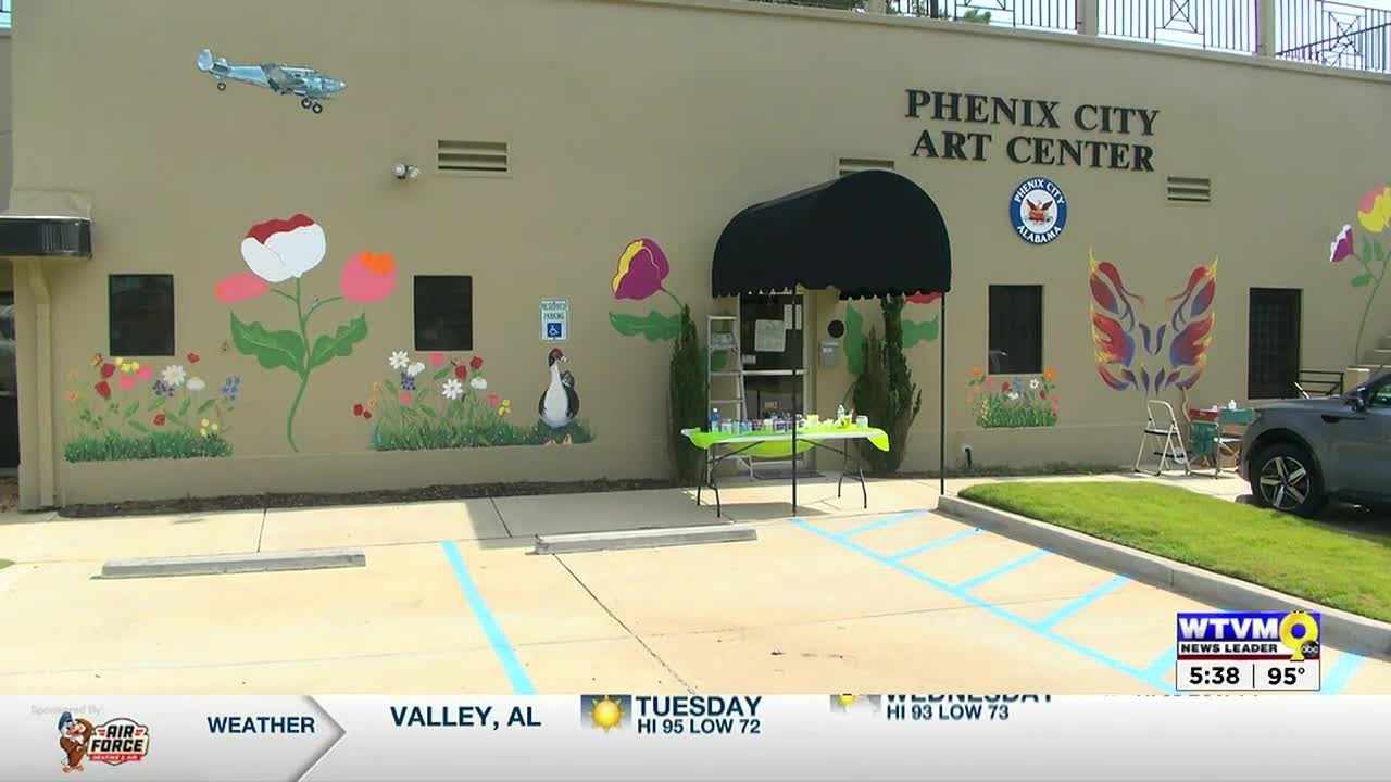 Community members working on new mural for Phenix City Art Center