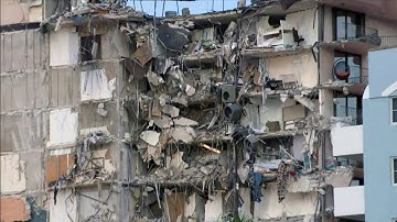 Engineers help search-and-rescue teams move under collapsed building