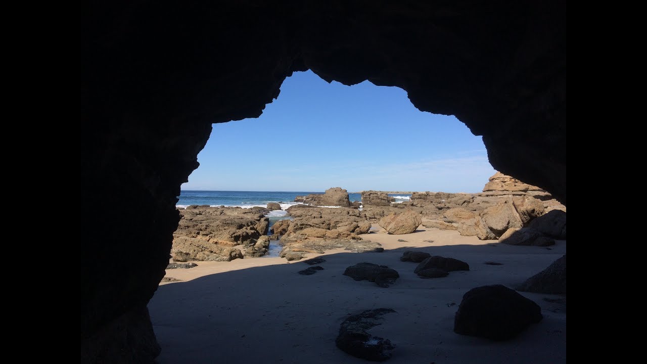 Exploring Caves Beach – Standing inside these amazing caves and looking out to the Tasman Sea