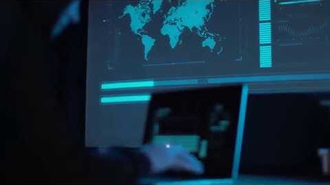 Man Working on Computer, World Map, Stock Footage with Music