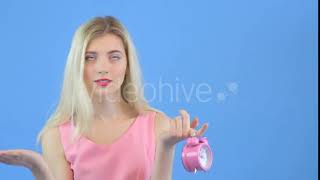 Attractive Yong Woman with Pink Alarm Clock | Stock Footage - Videohive screenshot 3
