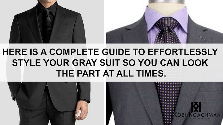 Black suit with purple shirt and tie