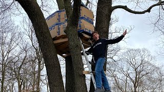 SLEEPING IN A CARDBOARD TREE HOUSE