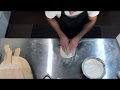 Stretching Pizza Dough by hand - Tutorial