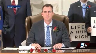 Gov. Kevin Stitt signs abortion bill from moment of conception into law