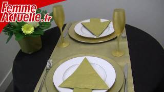 Decorating: Folding napkins into the shape of a Christmas tree