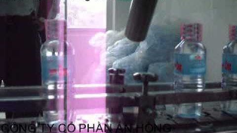 Máy in phun date lên chai nước tinh khiết