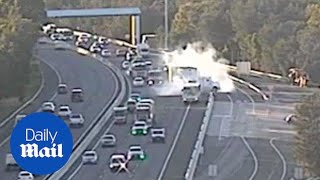 CCTV of near miss where a truck almost slammed into a school bus - Daily Mail