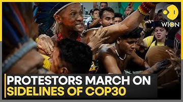 Protesters Force Their Way Into COP30 Summit Venue, Clash With Security | WION