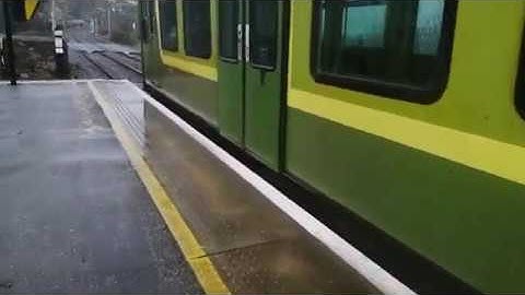 Boarding a Malahide bound DART in Killiney