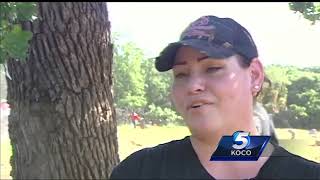 Volunteers take down fence segregating Oklahoma cemetery