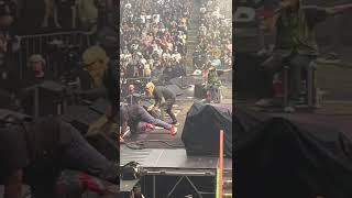 Fan rushes stage at Rage Against the Machine Show Toronto July 23 2022.  Tom Morello gets tackled