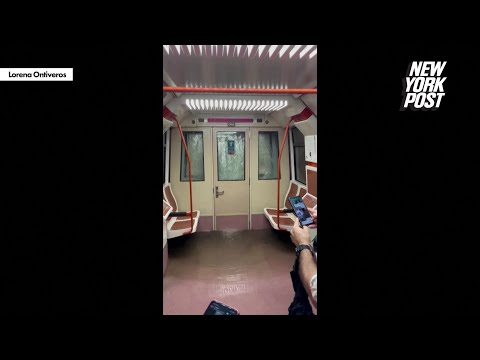 Scary moment Madrid commuters are caught in flooded metro