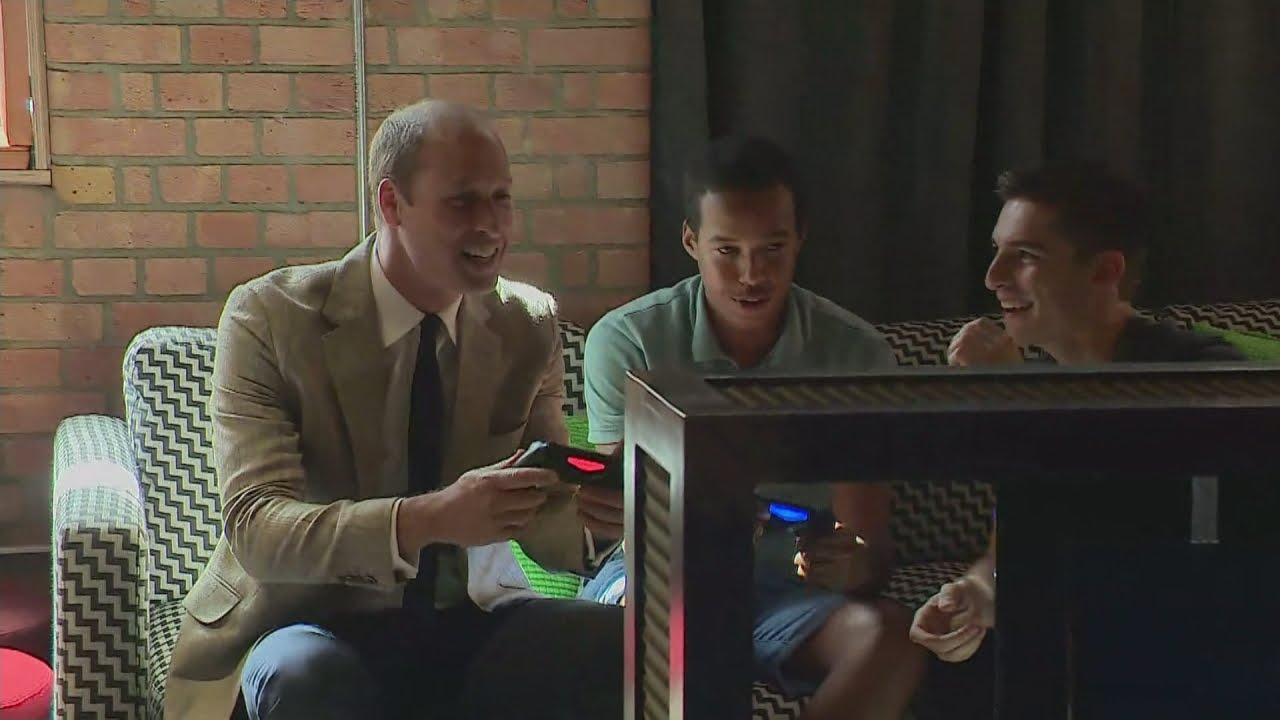 William plays Fifa and pool while Kate's in the kitchen on charity visit