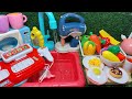 Diy mini food cookingwith cut fruits and vegetables for colorful dish using playdoh and kitchen set