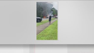 Fiery collision involving USPS truck leaves employee injured in Riverdale