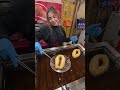 Frying the "paperclip" sweet from Naples. Italy streetfoot at Christmas marke