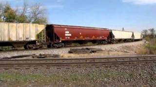 KCS 4011 Westbound HITTING The Diamonds With A Loaded Grain Train.ace leading kcs belle,