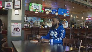 Albert 'Prince' Bell signs a bun at Tony Packo's Wealth