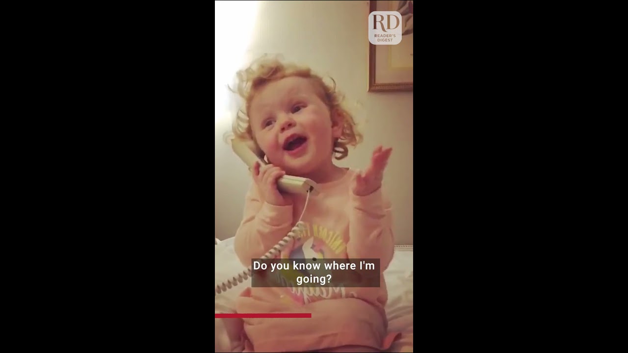 Cute Little Girl Gossips On The Phone