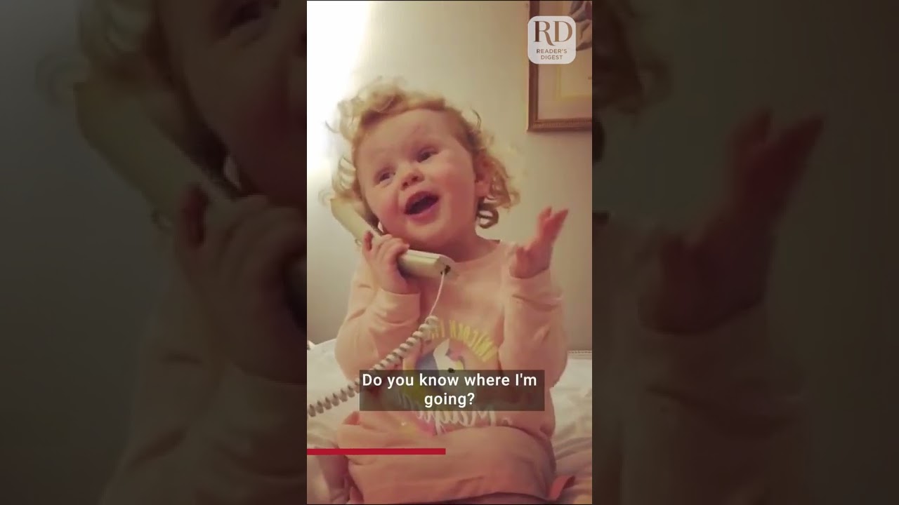 Cute little girl gossips on the phone