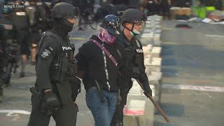 Seattle police push protesters out of CHOP zone