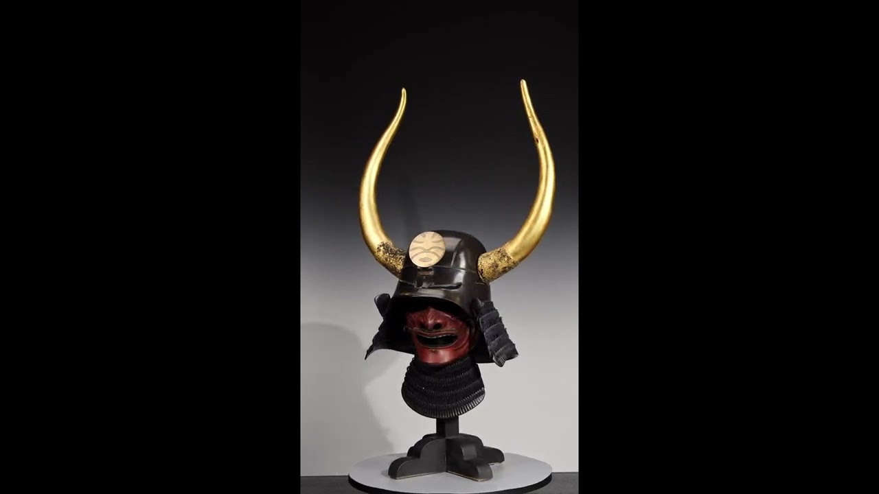 Lot 94 - A LACQUERED IRON ZUNARI KABUTO WITH HORNED