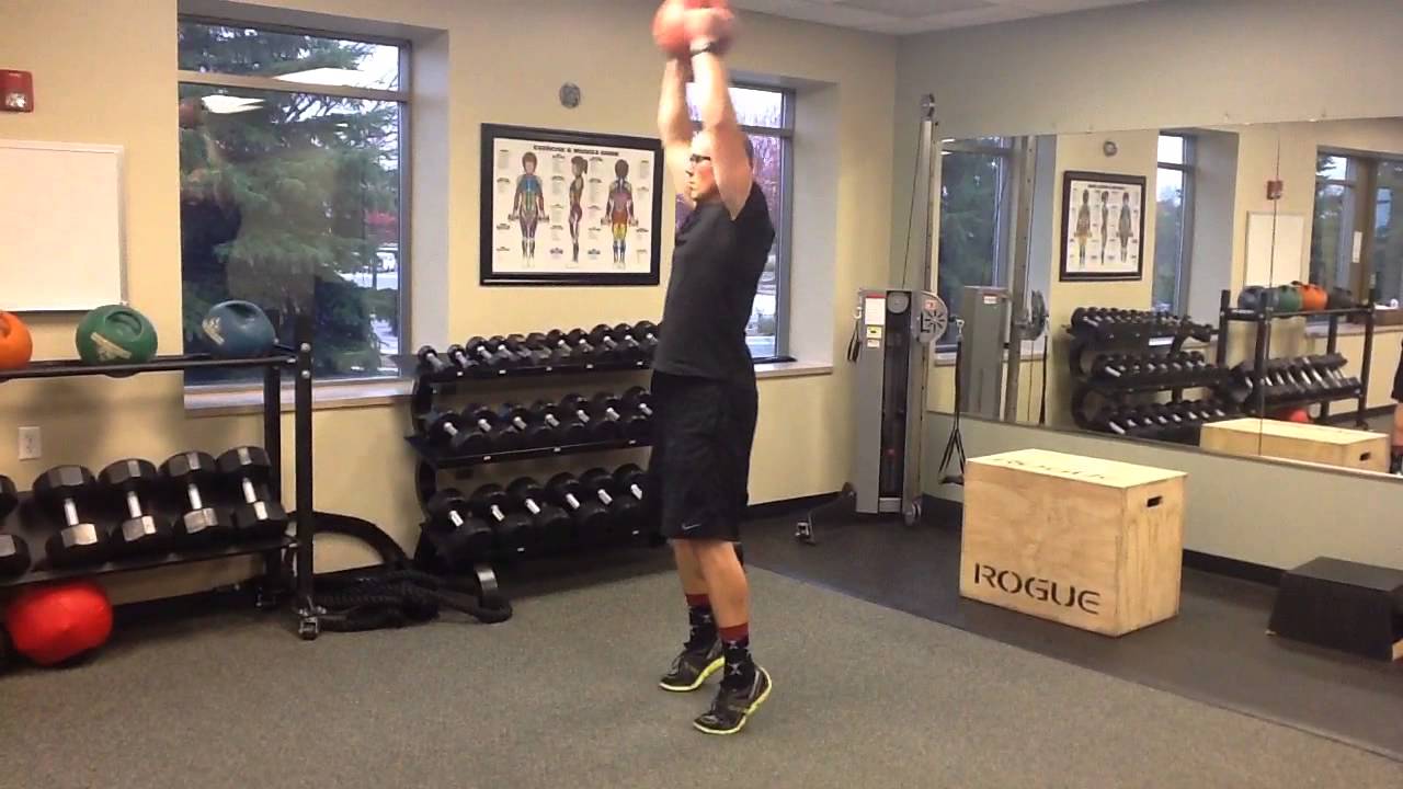 Squat to Overhead Lift with Medicine Ball 