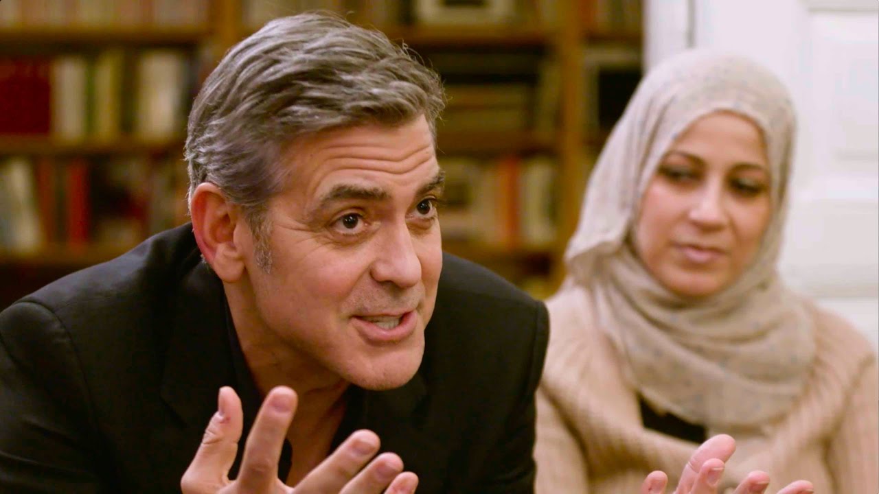 أمل وجورج كلوني يتحدثان مع عائلات سورية في برلين على موقع يوتيوب