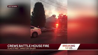 Crews battle house fire in Winston-Salem