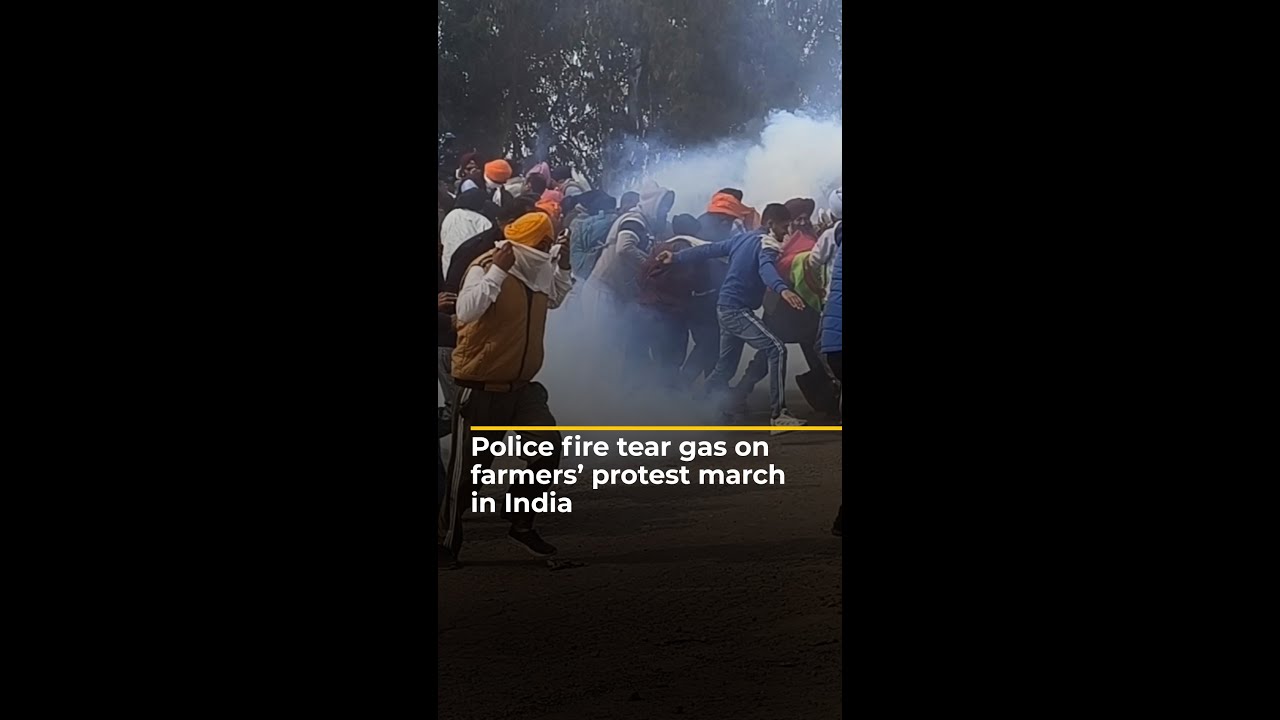 Riot police fire tear gas on farmers protesting in India | 
