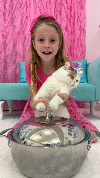Nastya and dad play with cat