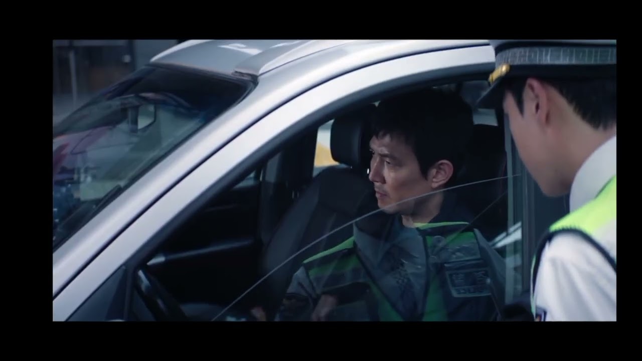 Gi Hun gets a ticket from the cops for exceeding the speed limit