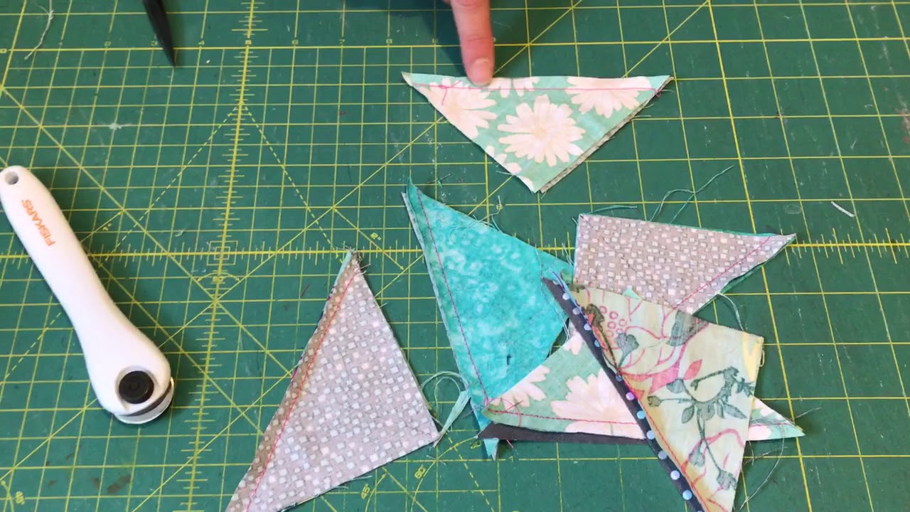 Easy Half Square Triangles using the Clearly Perfect Slotted Trimmers by  New Leaf Stitches 