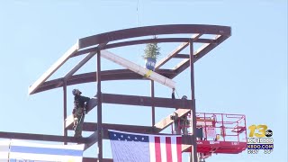 Pueblo leaders hold a Riverwalk Boathouse beam signing ceremony