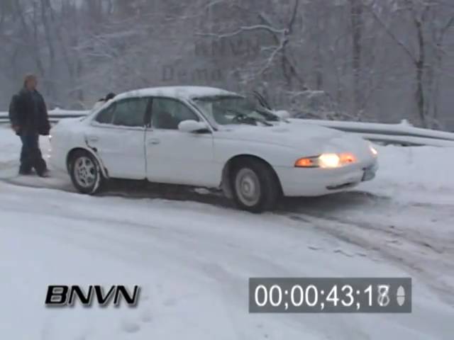 12/31/2006 Heavy snow and traffic backed up and delayed footage.