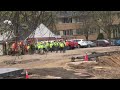 Workers at Discovery Square construction site.