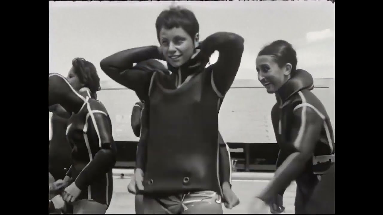 French scuba club women get suited up in vintage wetsuits (60's?)
